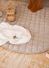 Natural Linen Plat Mat with wooden toys and linen swaddles placed on top 